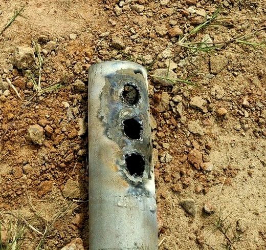 Cut pile shaft with three torch-burned bolt holes